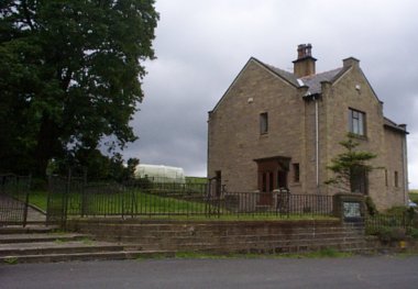 Picture of restored lodge next to Quaker graveyard above Trawden.