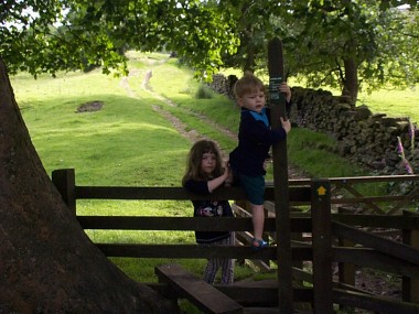 Picture of children crossing a style at Wycoller - click the picture for more of the beauty of Pendle in Pictures.